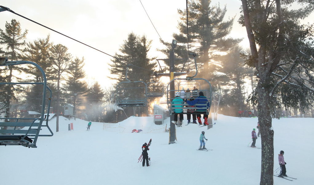 Family riding the chairlift at Nashoba Valley Ski Area