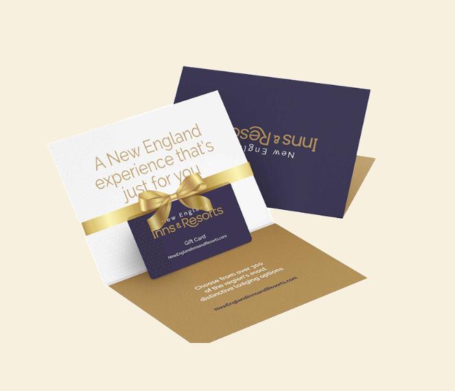Gift card with gold bow and elegant New England theme packaging.