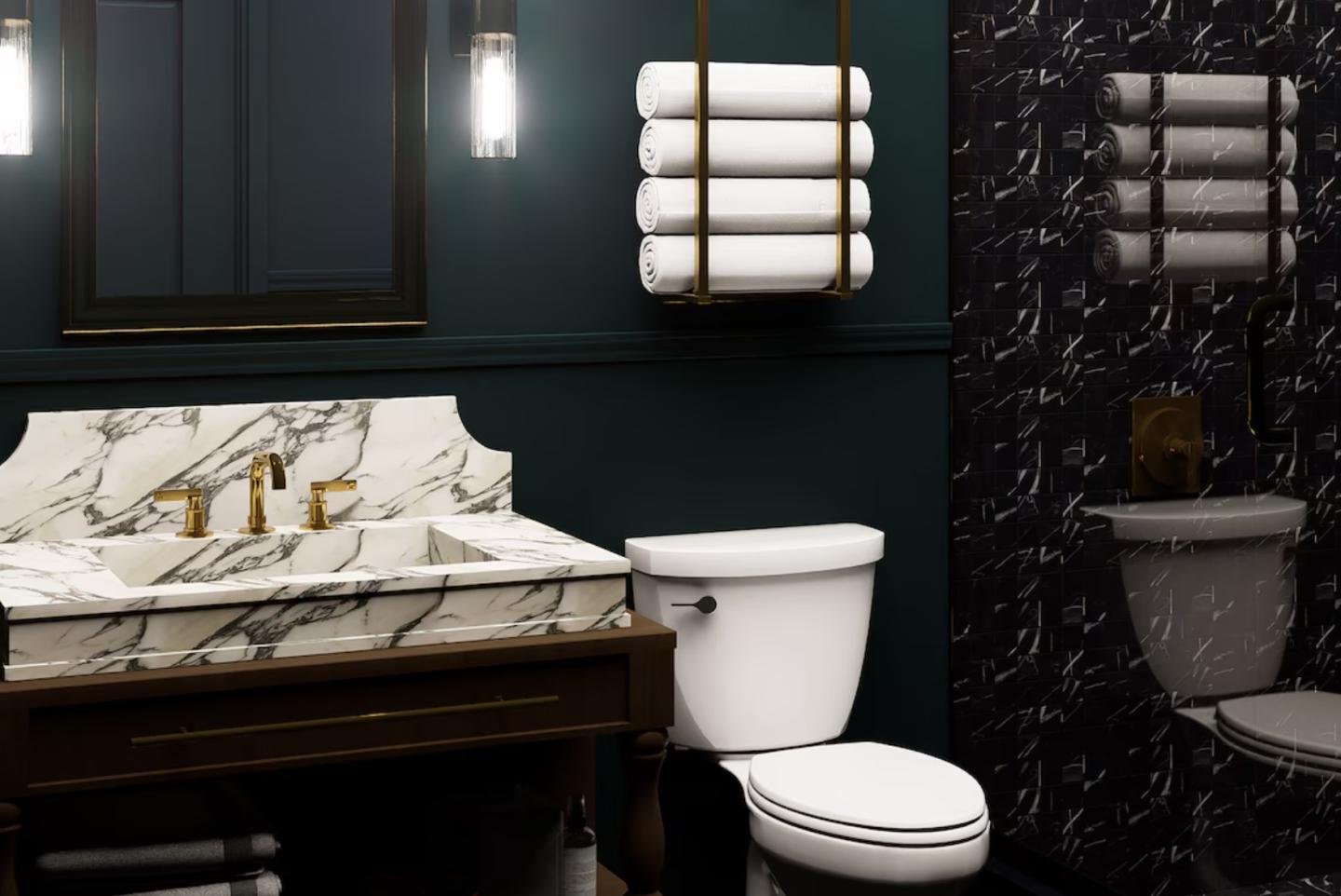 Elegant bathroom with marble sink, toilet, and stacked towels.