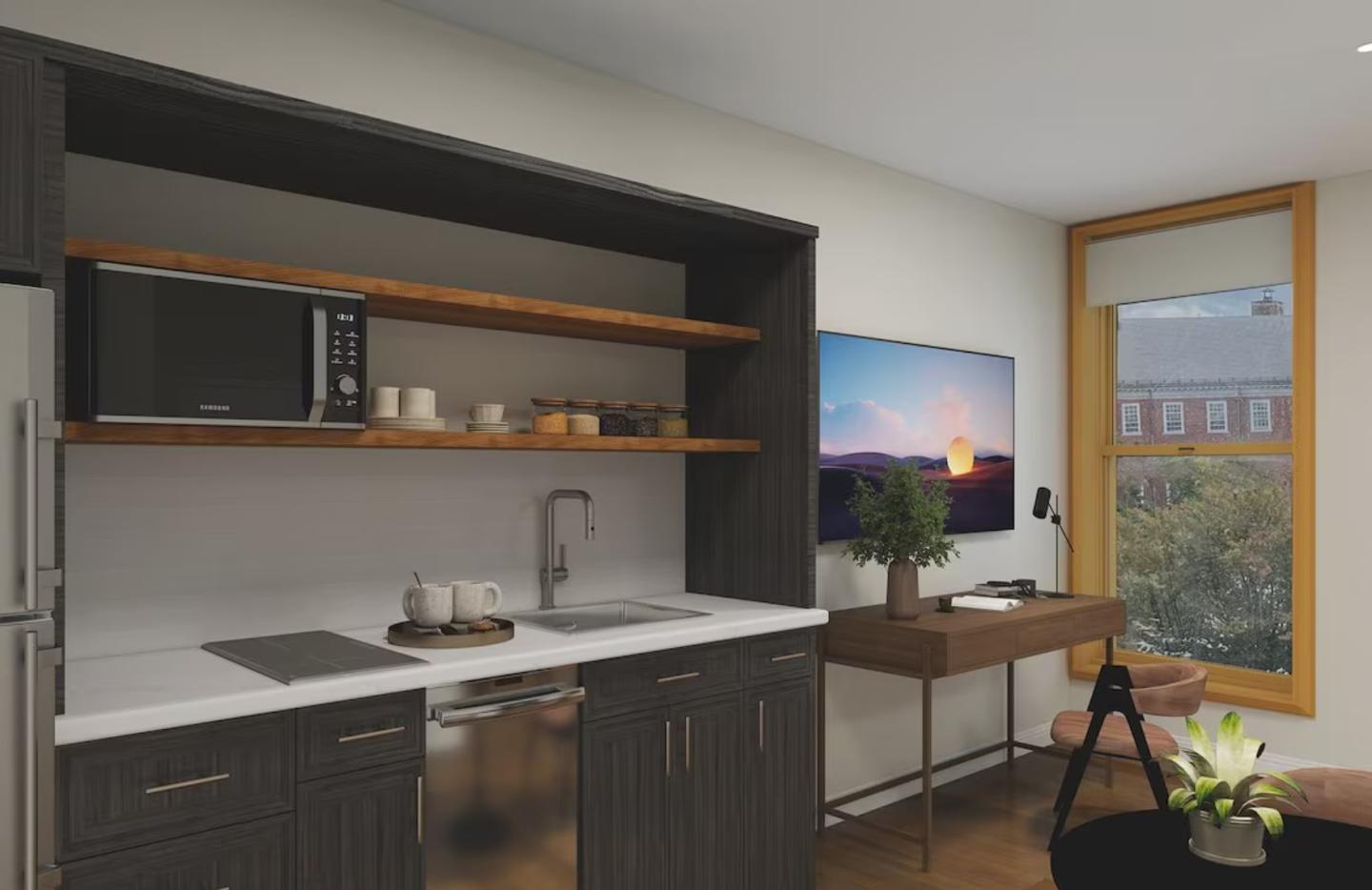 Modern kitchen and living area with a TV and window view.