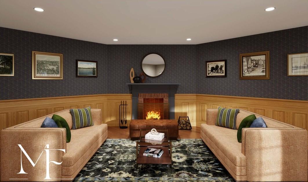 Cozy living room with fireplace, sofas, and wall art.