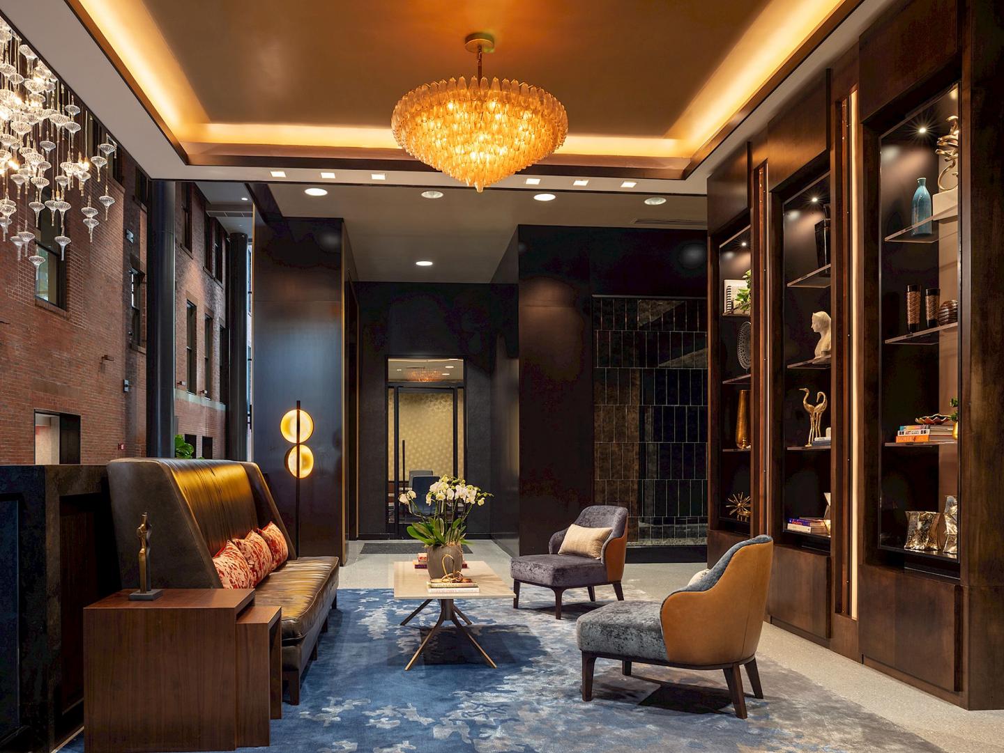Luxurious hotel lobby with plush seating, warm lighting, and elegant decor.