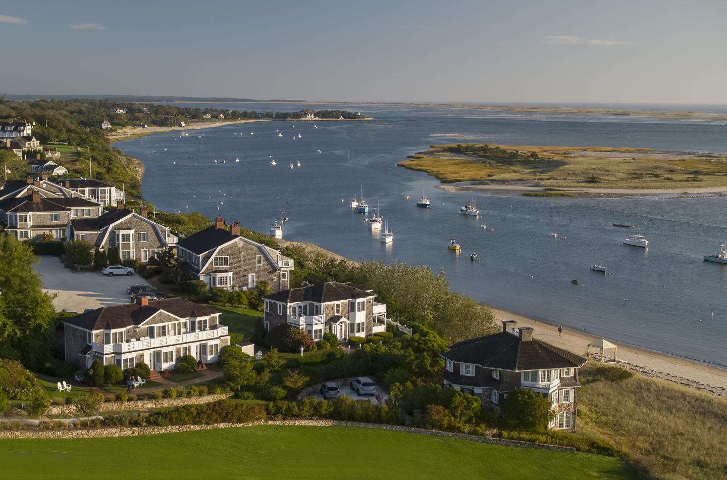 Coastal houses with boats on a sunny day.