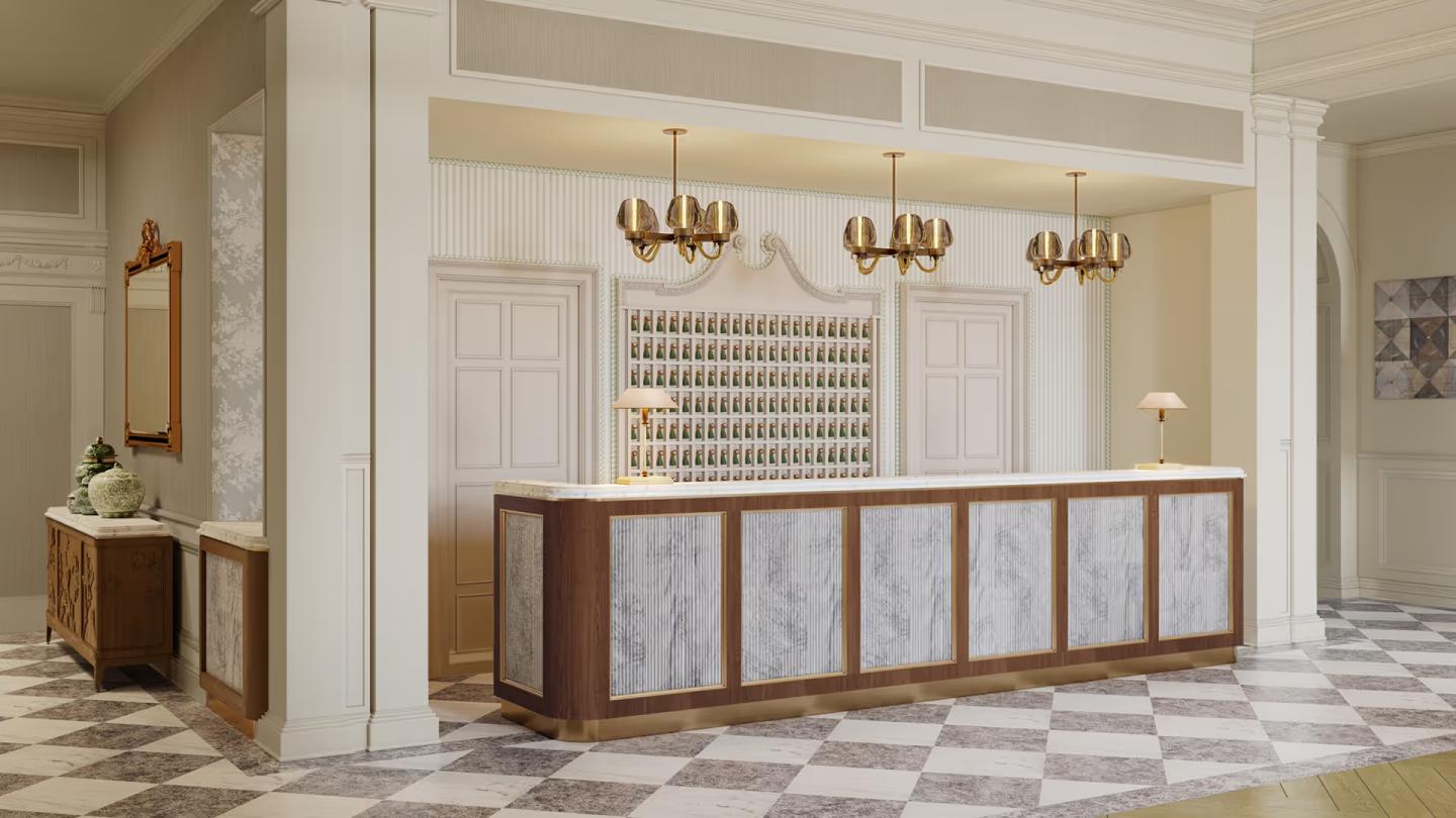 Hotel reception with elegant chandeliers and a marble front desk.