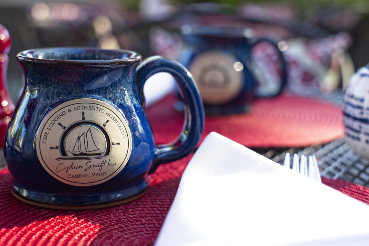 Inn mug on outdoor dining deck