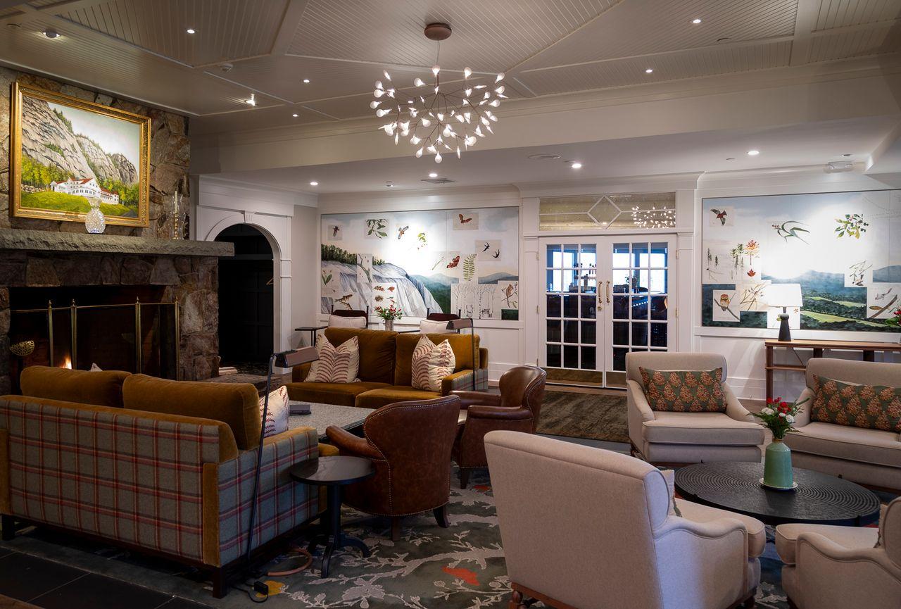 Cozy hotel lobby with seating, fireplace, and decorative lighting.