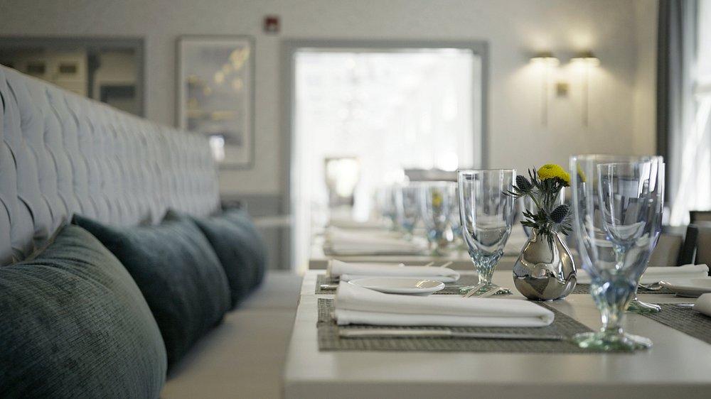 Elegant restaurant table set with glassware and napkins.