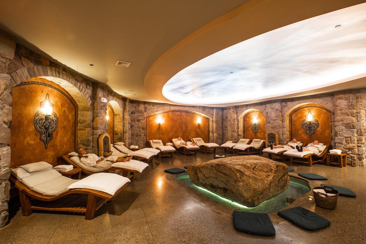 Interior view of spa with message tables lining the wall