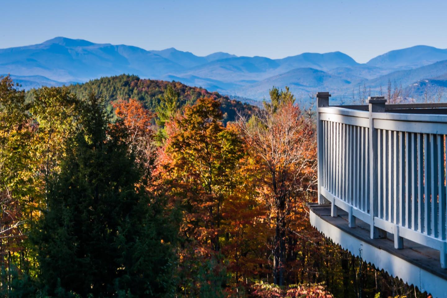 View of mountains from deck with fall foliage