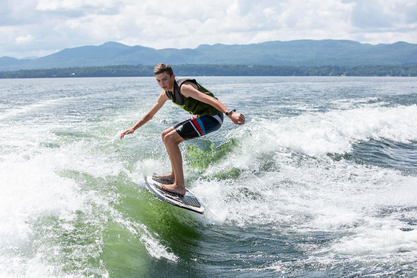 Boy wake surfing on Lake Champlain
