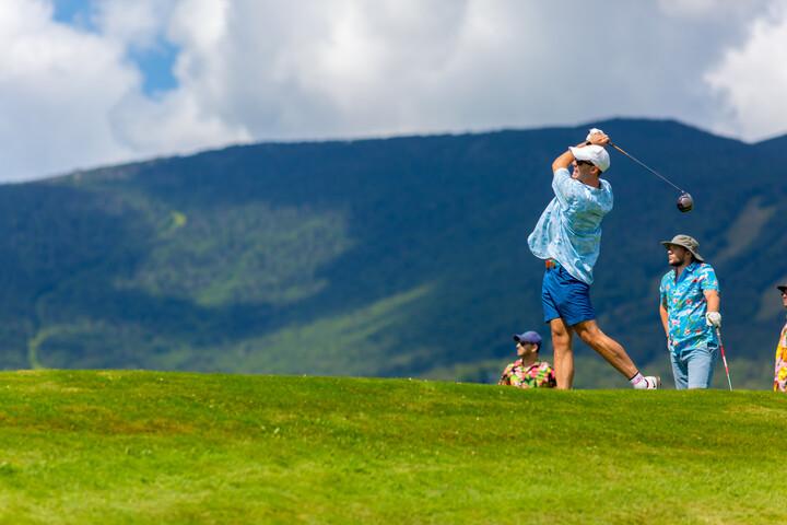 Man taking a swing on the golf course