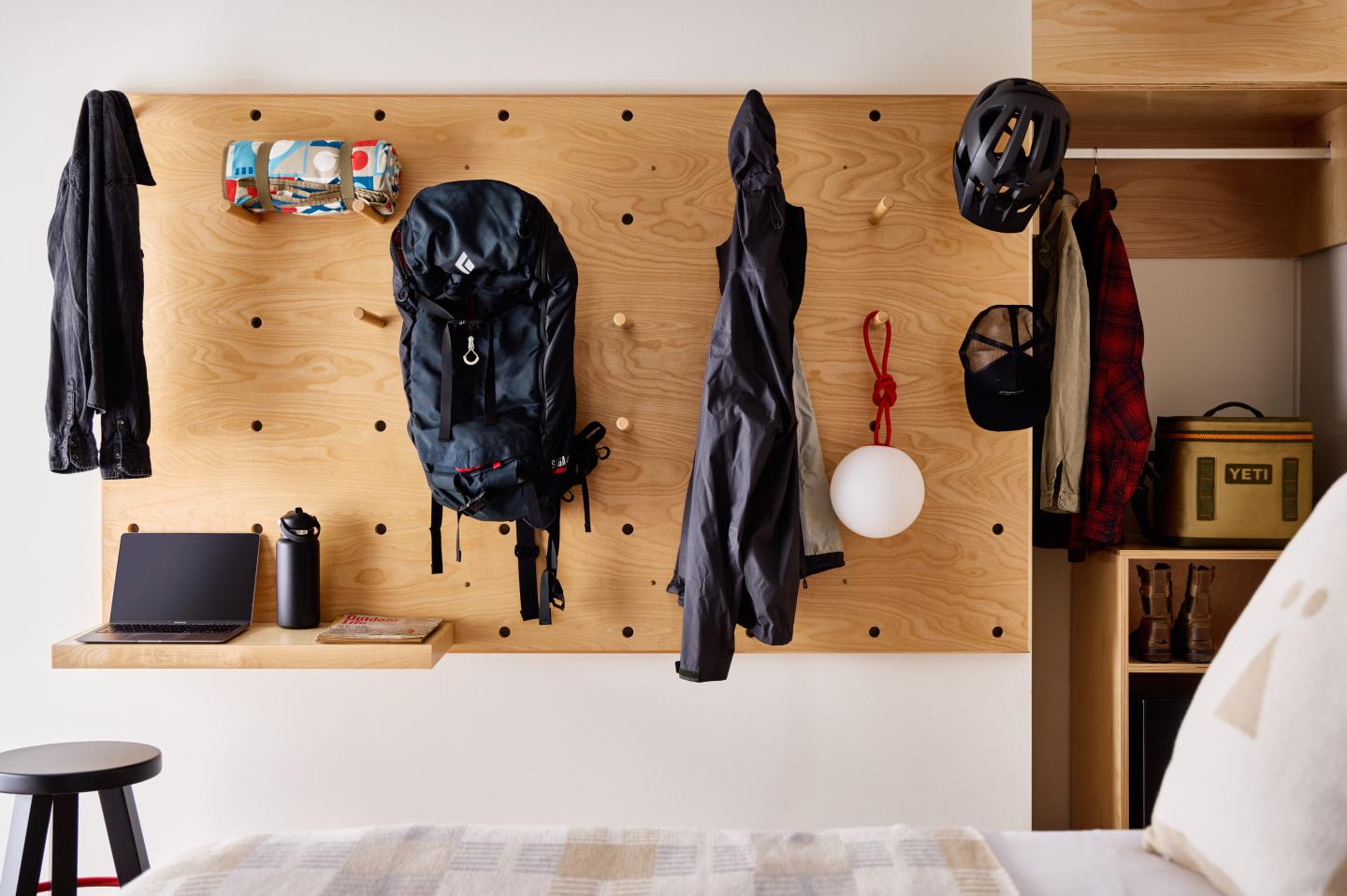 Gear wall in a guest room at Tälta Lodge