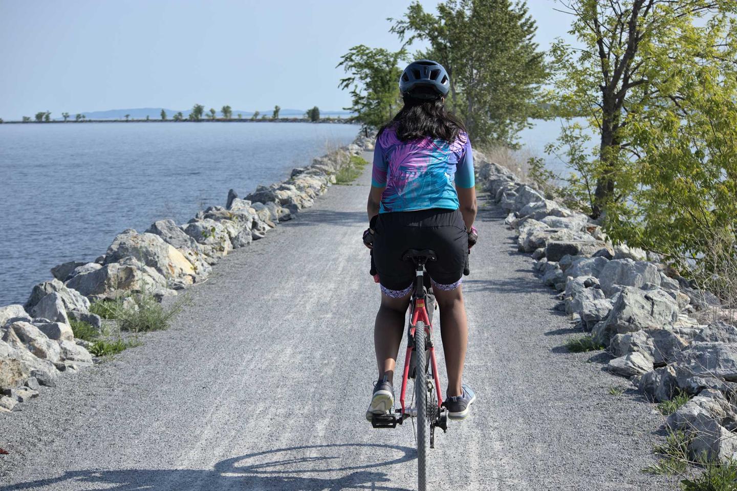 Single person riding a gravel bike by the coast