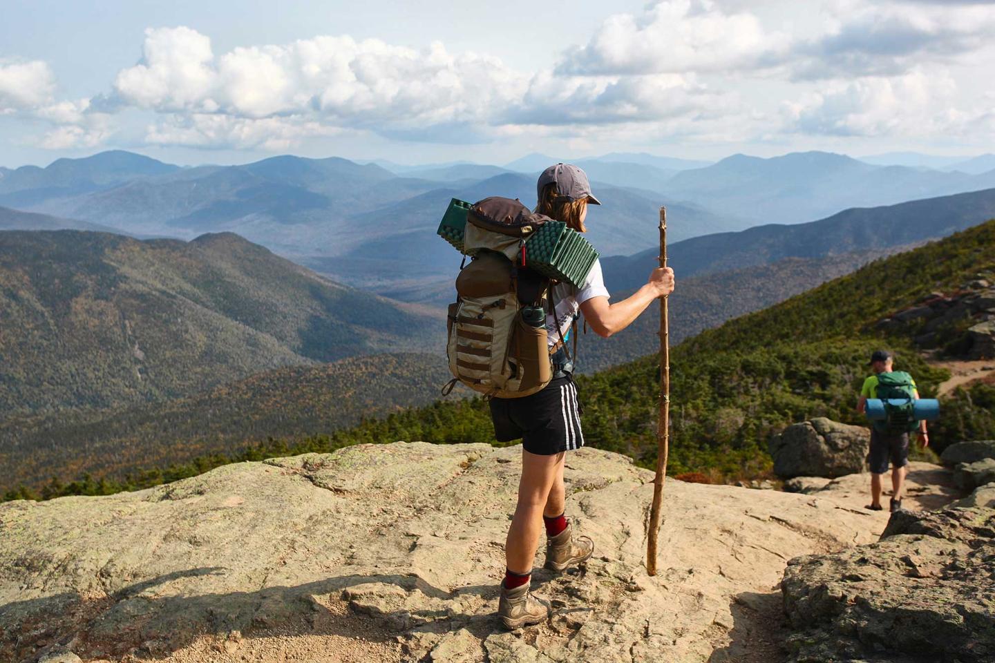 Two people backpacking along a ridge line