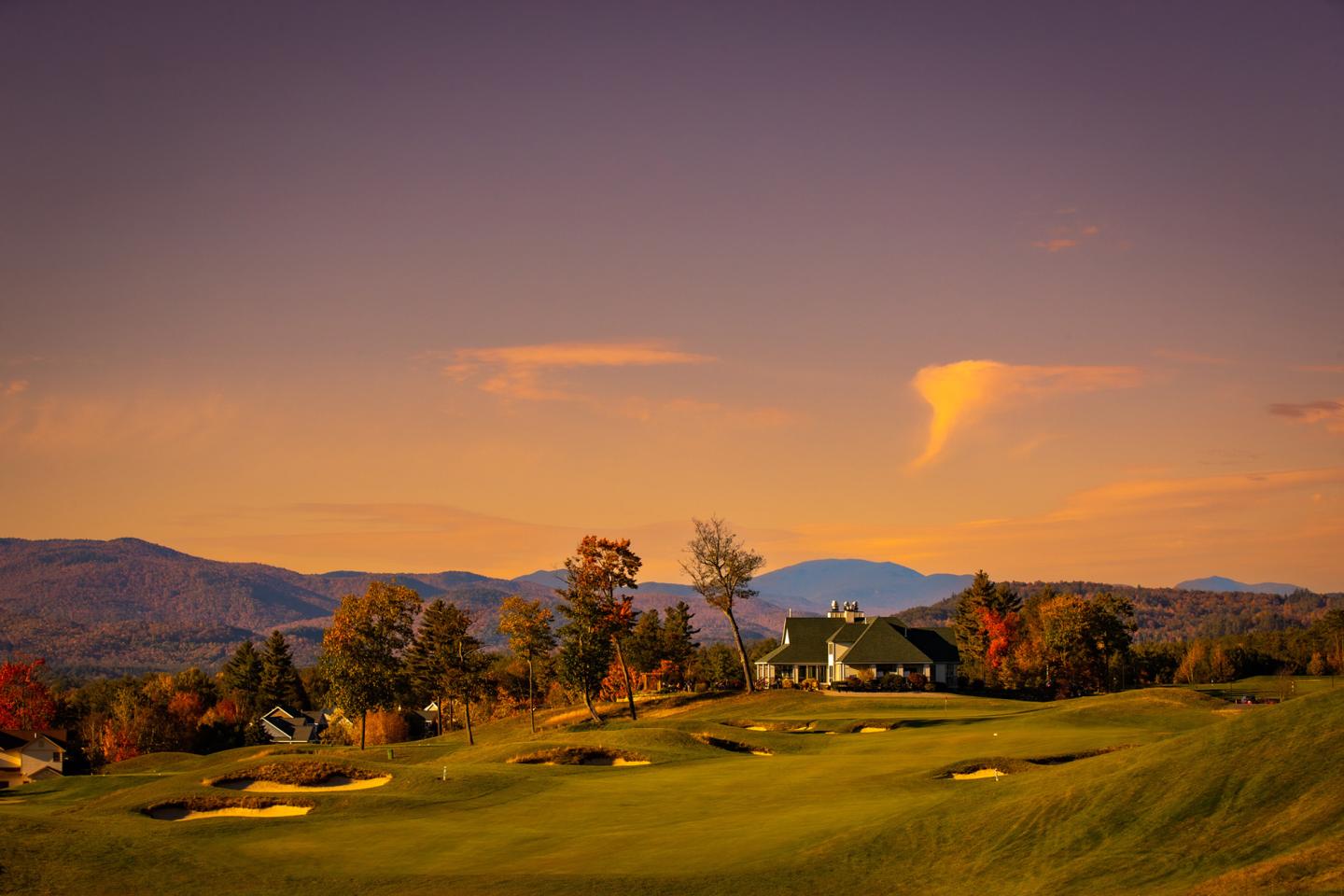 Beautiful sunset image over a golf course with fall foliage