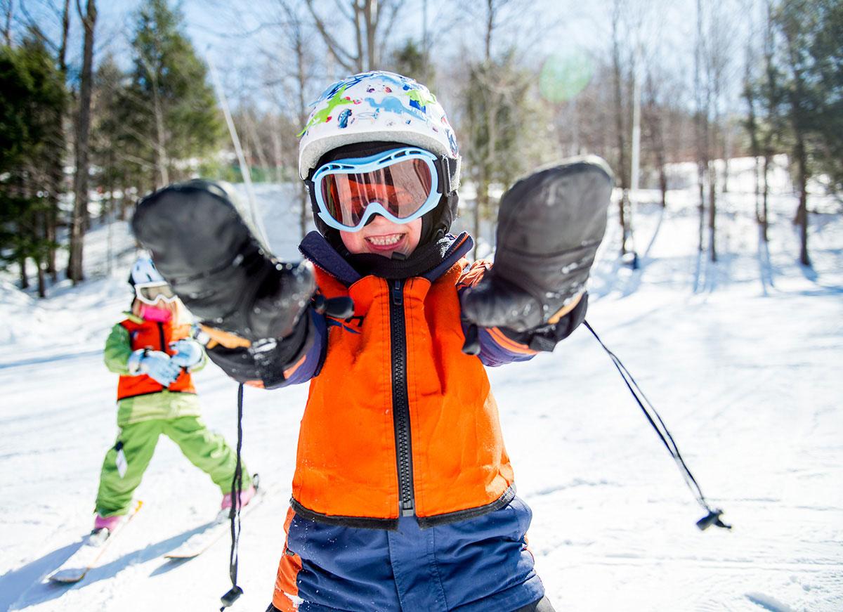 Two kids skiing
