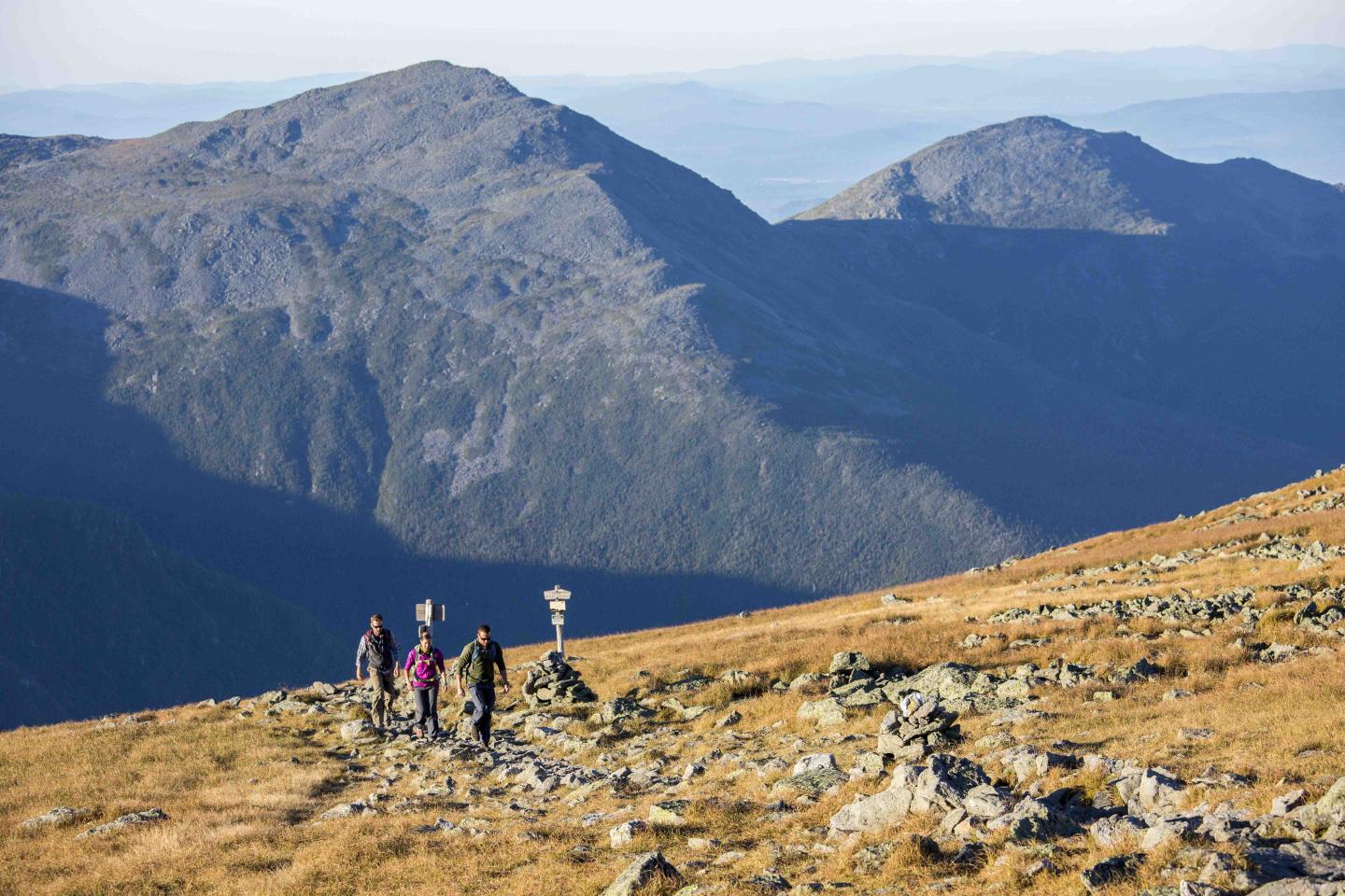 Group of hikers with large mountains in the background