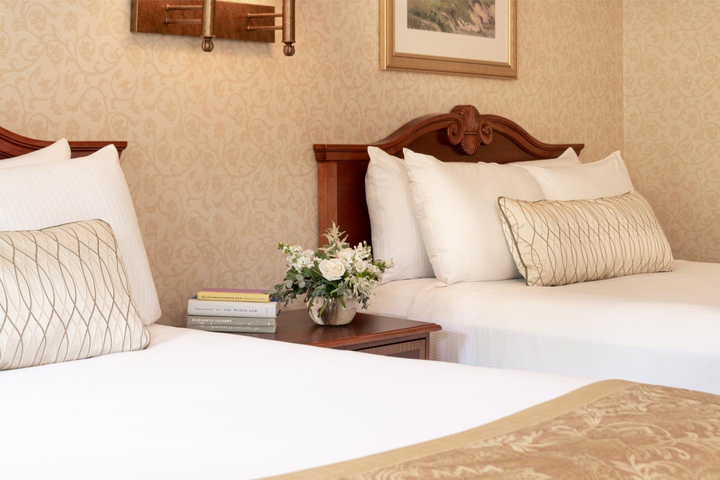 Our Queen Bed Guest Rooms offer two beds side by side dressed with plush pillows and crisp linens. 
