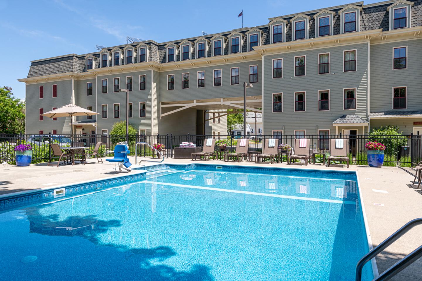 Our outdoor pool is open seasonally, offering space to cool off. Lounge chairs surround the pool with fresh towels. 