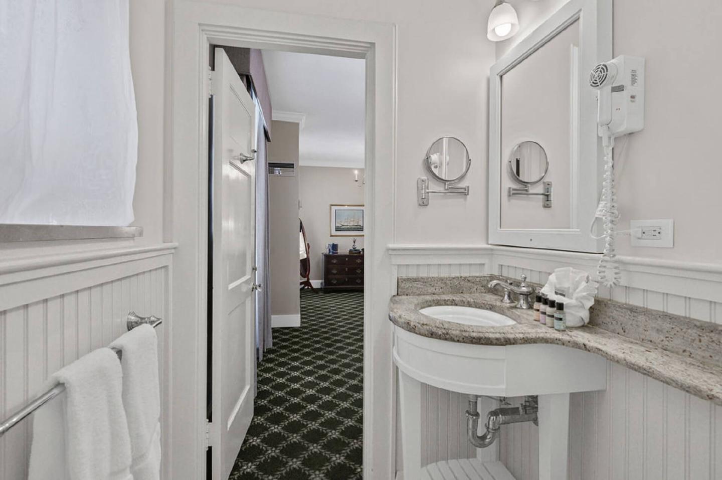 Bathrooms are compact but updated with granite