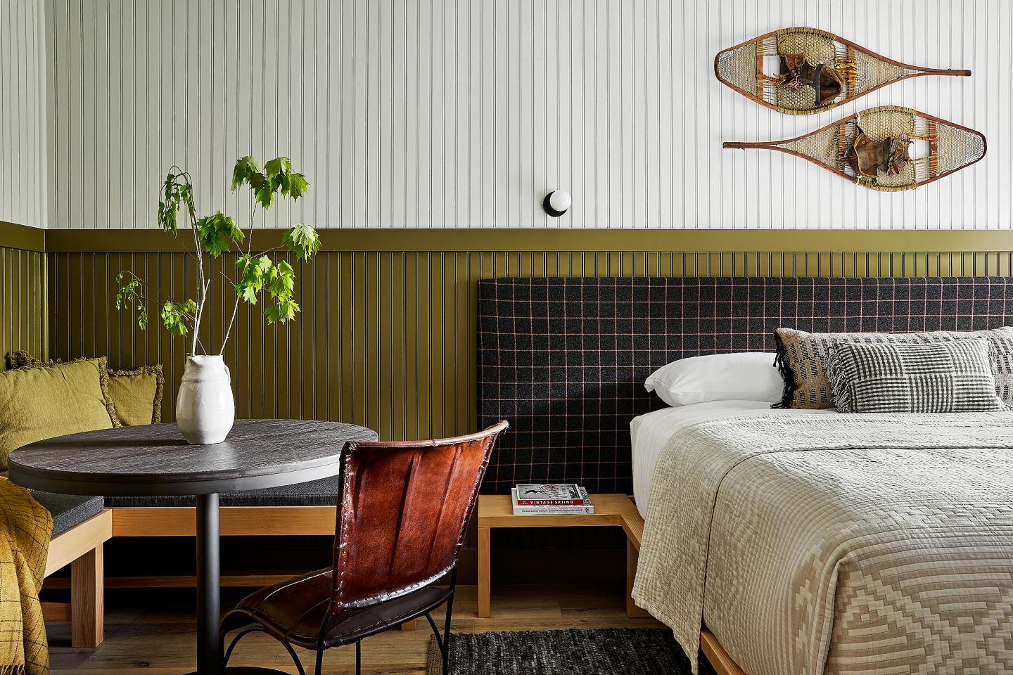 Bench seating area inside a king guest room at Bluebird Sunapee