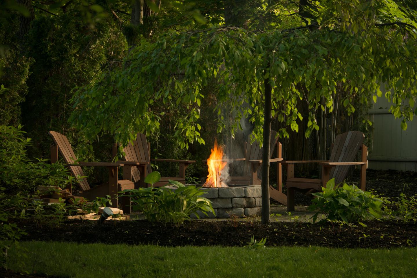 Backyard fire pit and seating area.