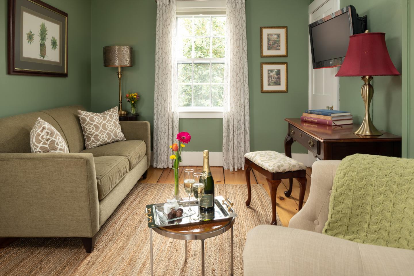 sitting room with sofa, chair, and table