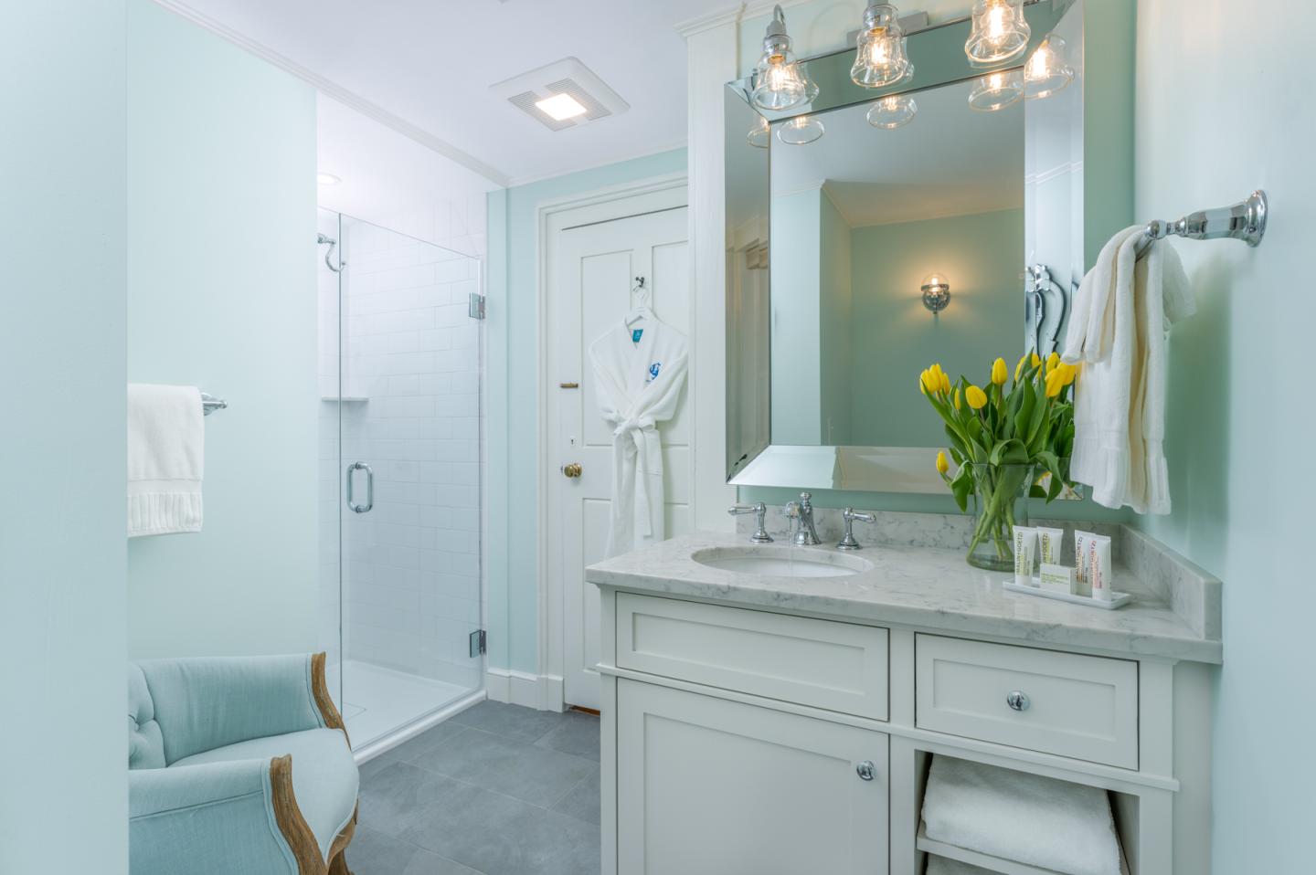 Bathroom vanity, chair, shower