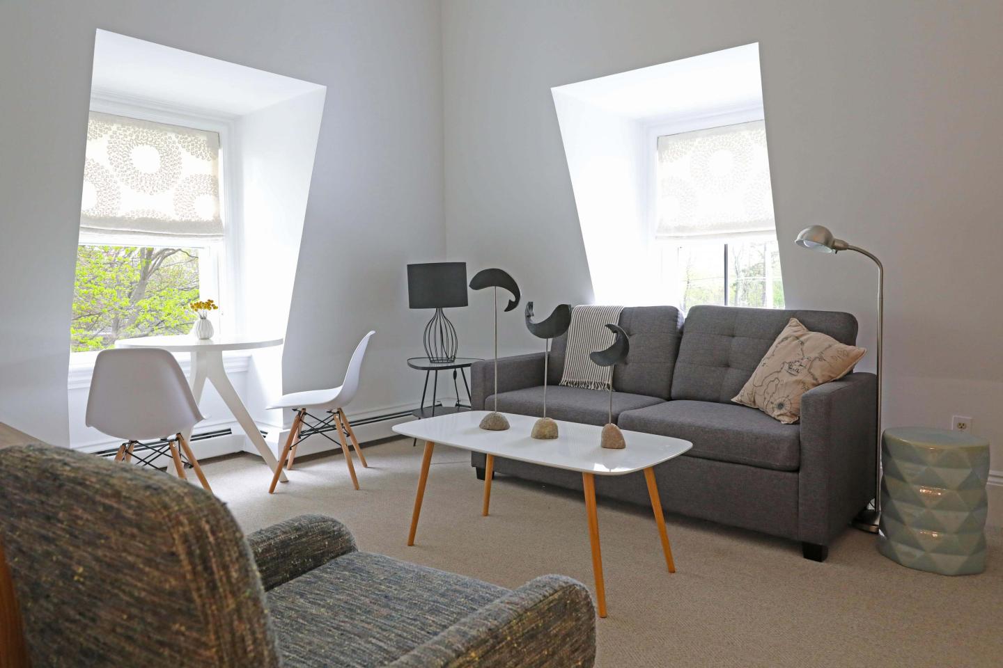 Living space in guest room suite at The Hotel Marblehead