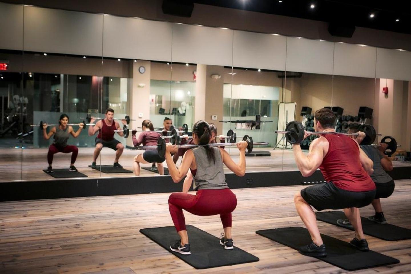 Two people participating in a Lynx workout class