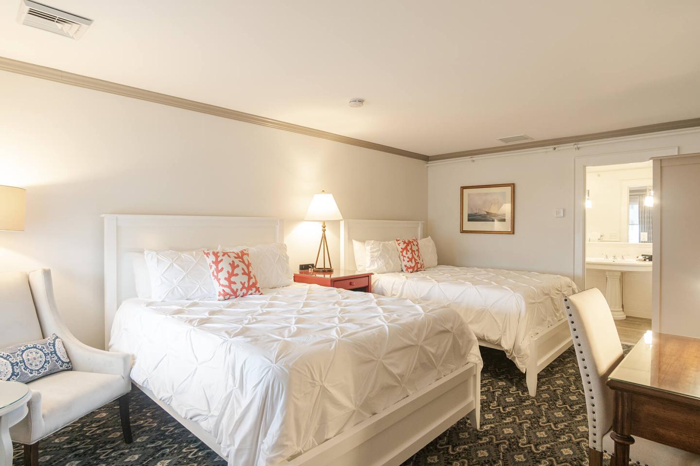 Two Queen beds with crisp white linens