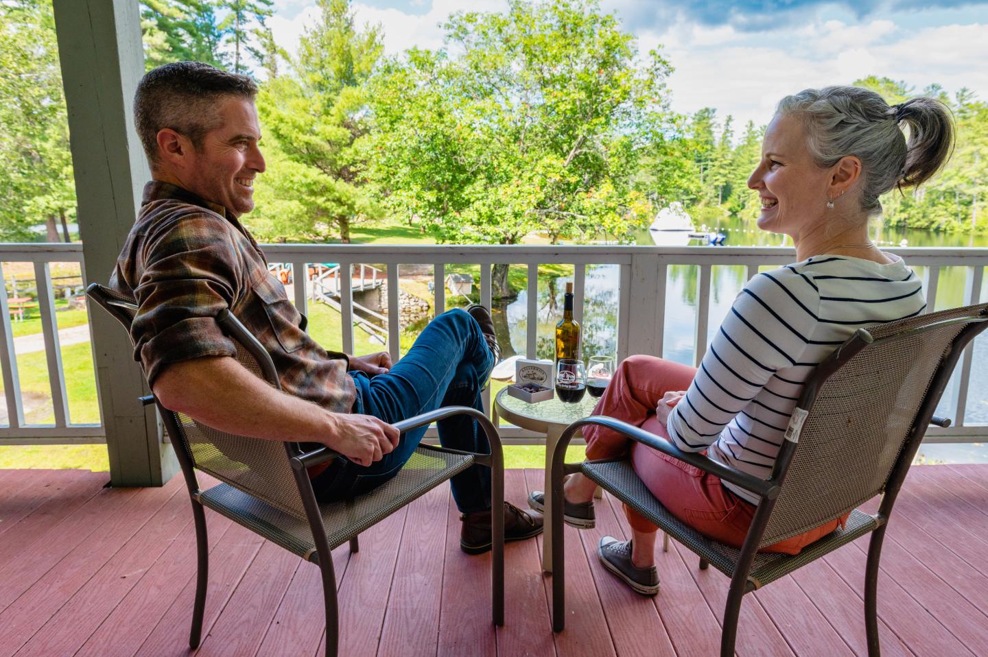 A couple enjoying Romance Package items and lake views at Purity Spring Resort