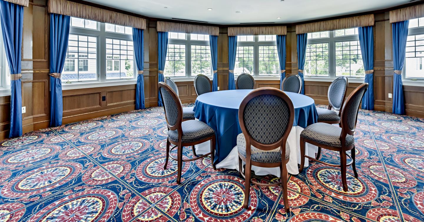 Meeting room with one large table, chairs and windows