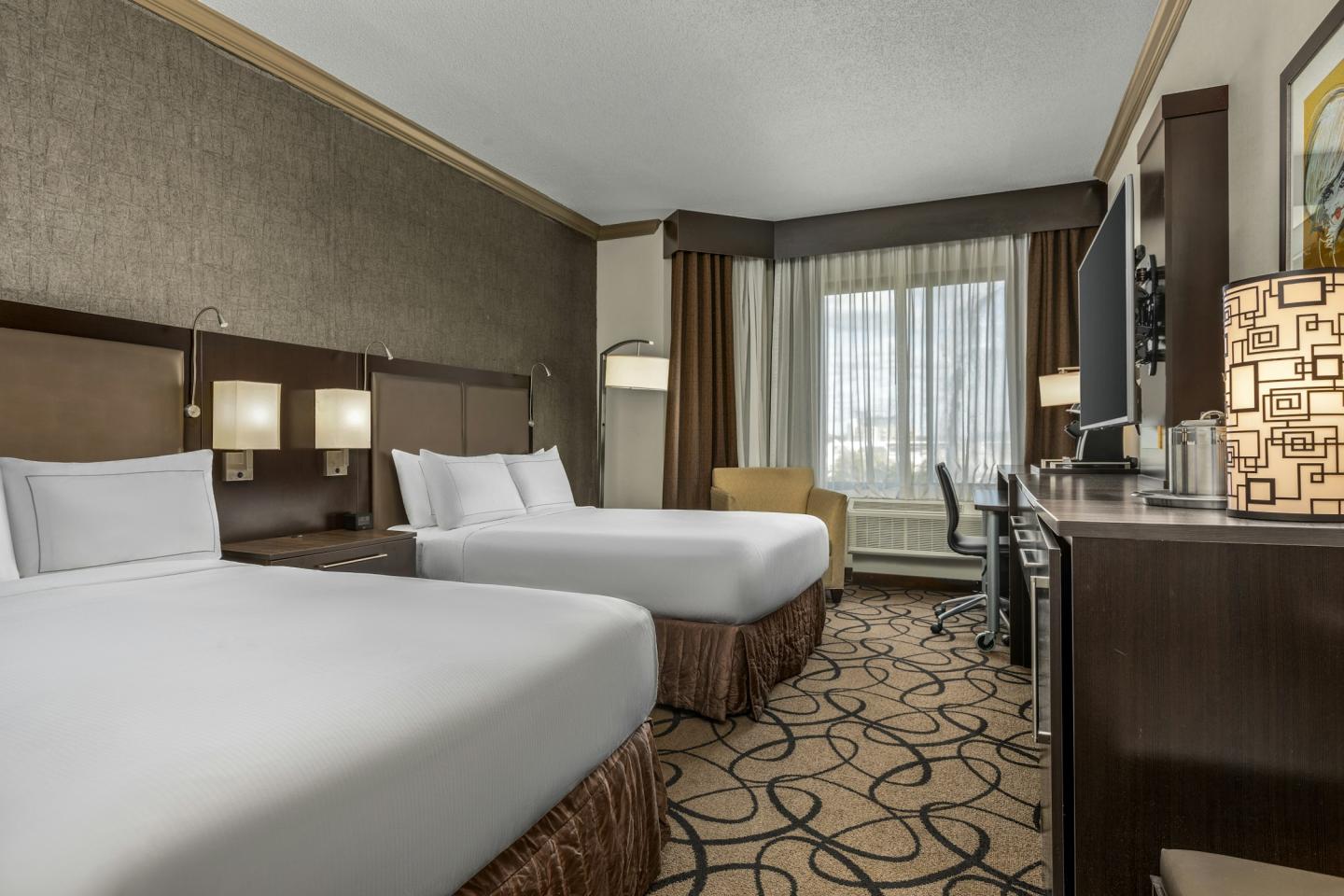 deluxe guest room with two double beds