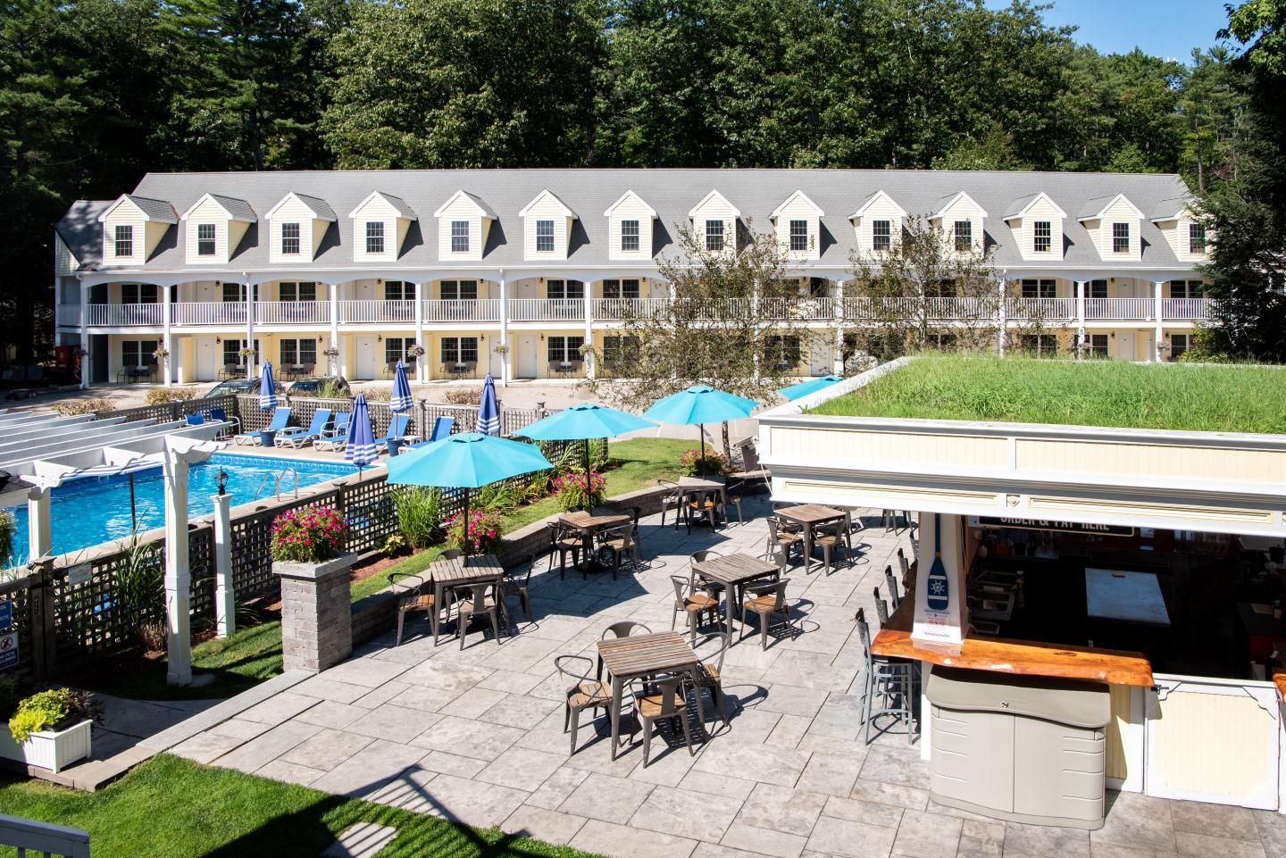 A view of our patio bar and pool area with the Flagship building in the background