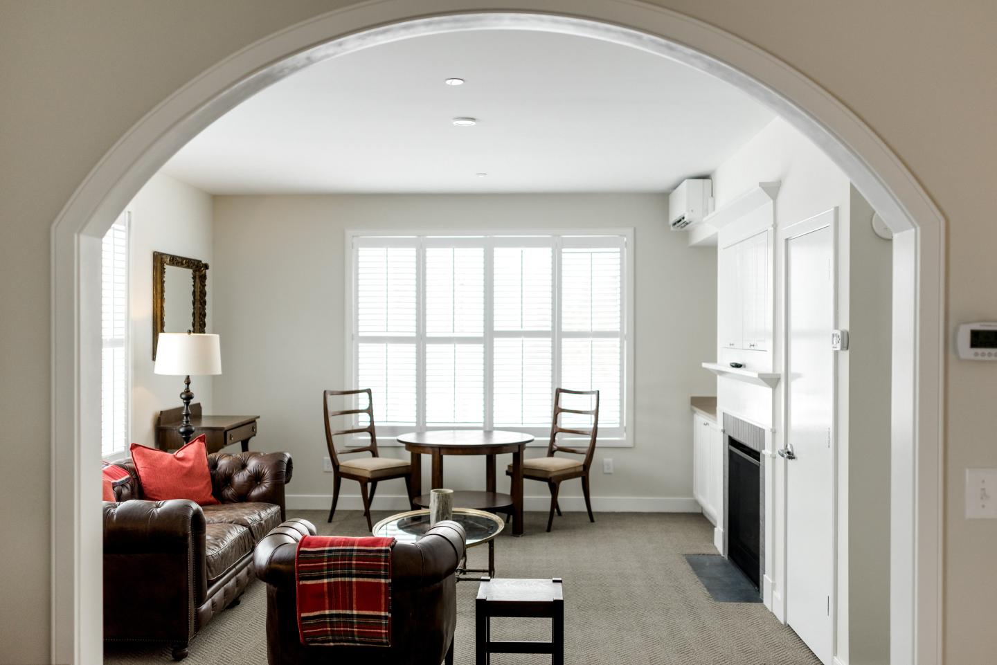 Grand King Suite at Briar Barn Inn with seating area, and fireplace