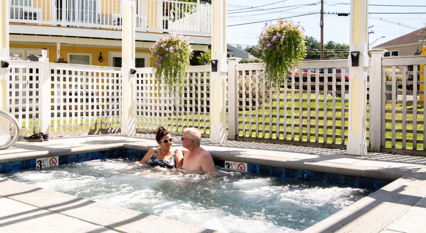 A couple enjoying our hot tub and pool area