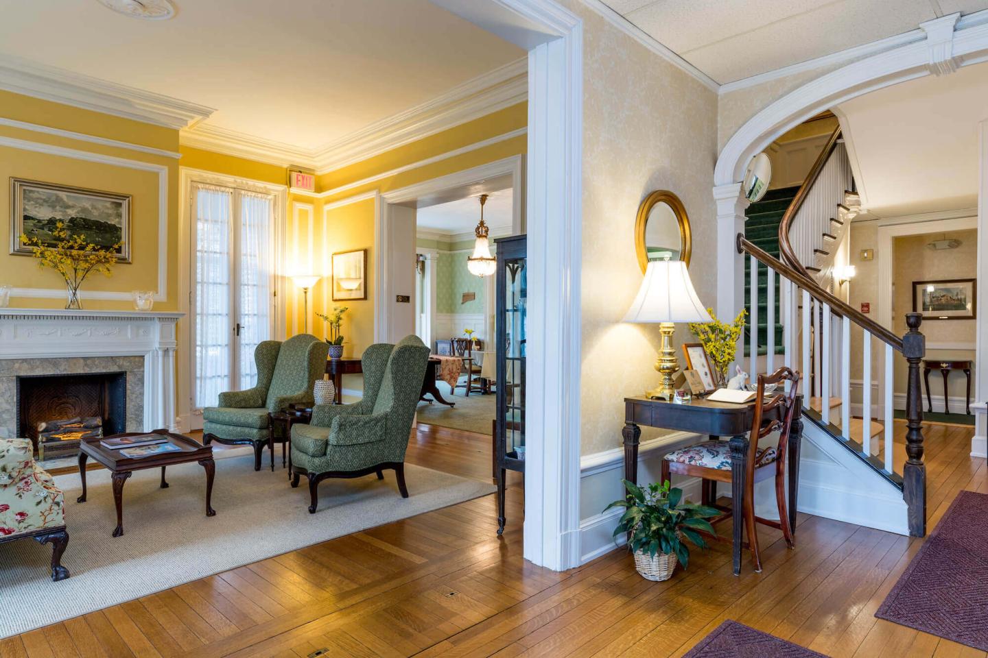 View of the living room and dining room from the front entryway of Stanton House Inn, a downtown Greenwich, Connecticut, bed and breakfast