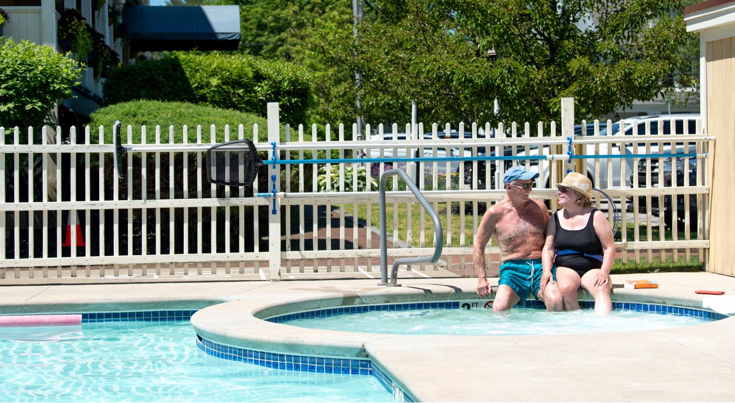 couple enjoying the hot tub and pool at the colonial inn Ogunquit Maine