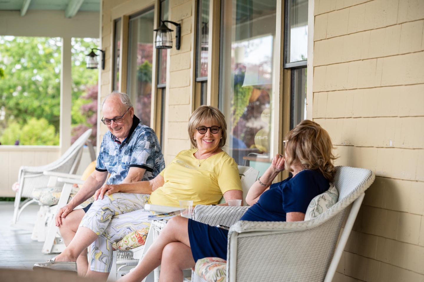 friends on wrap around porch at the colonial inn Ogunquit Maine
