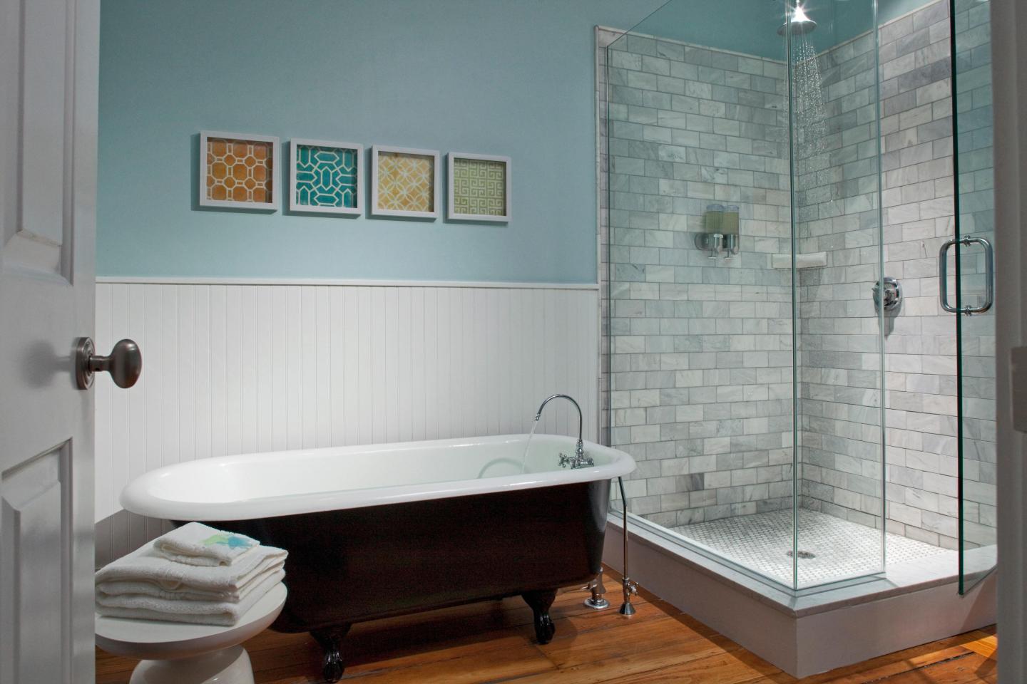 Our Nobska room with private bath with a rain shower and an antique claw foot soaking tub