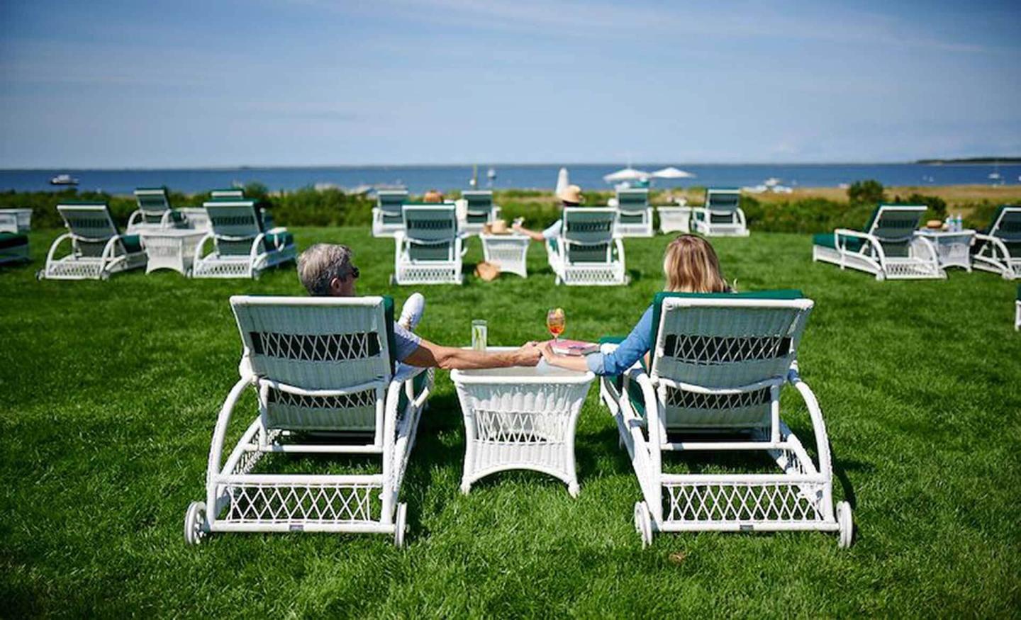 Couple sitting by the water at The Wauwinet, Nantucket, MA