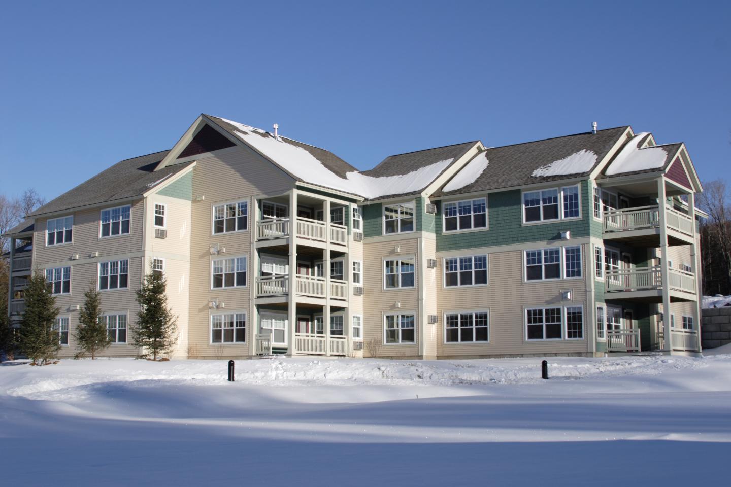 Exterior of Smugglers Notch Resort with snow