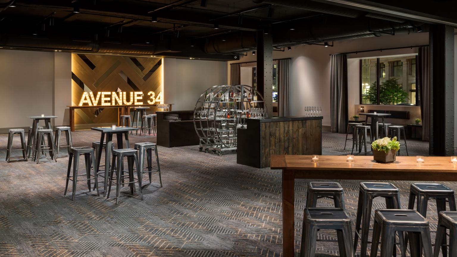 Avenue34 open set up with a bar and high tops