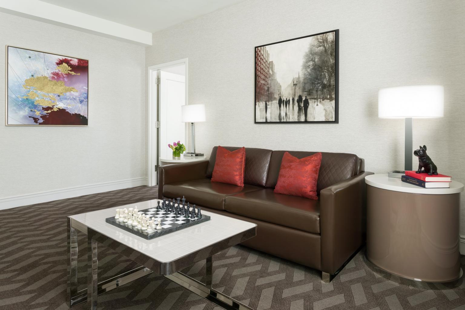 Living room with a couch, table, side table and lamp