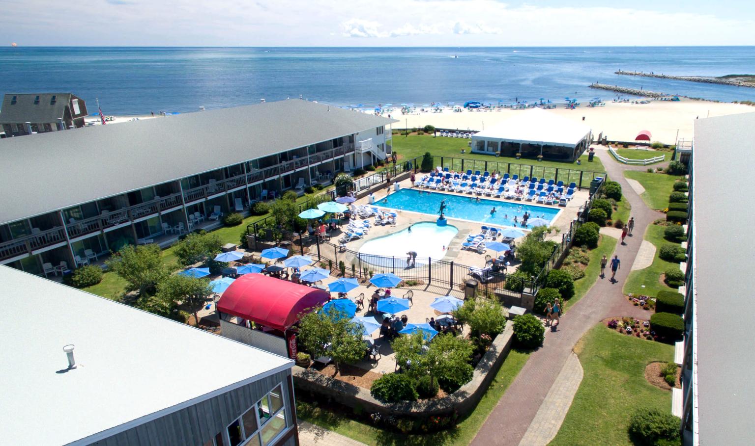 View of outdoor pool and private beach