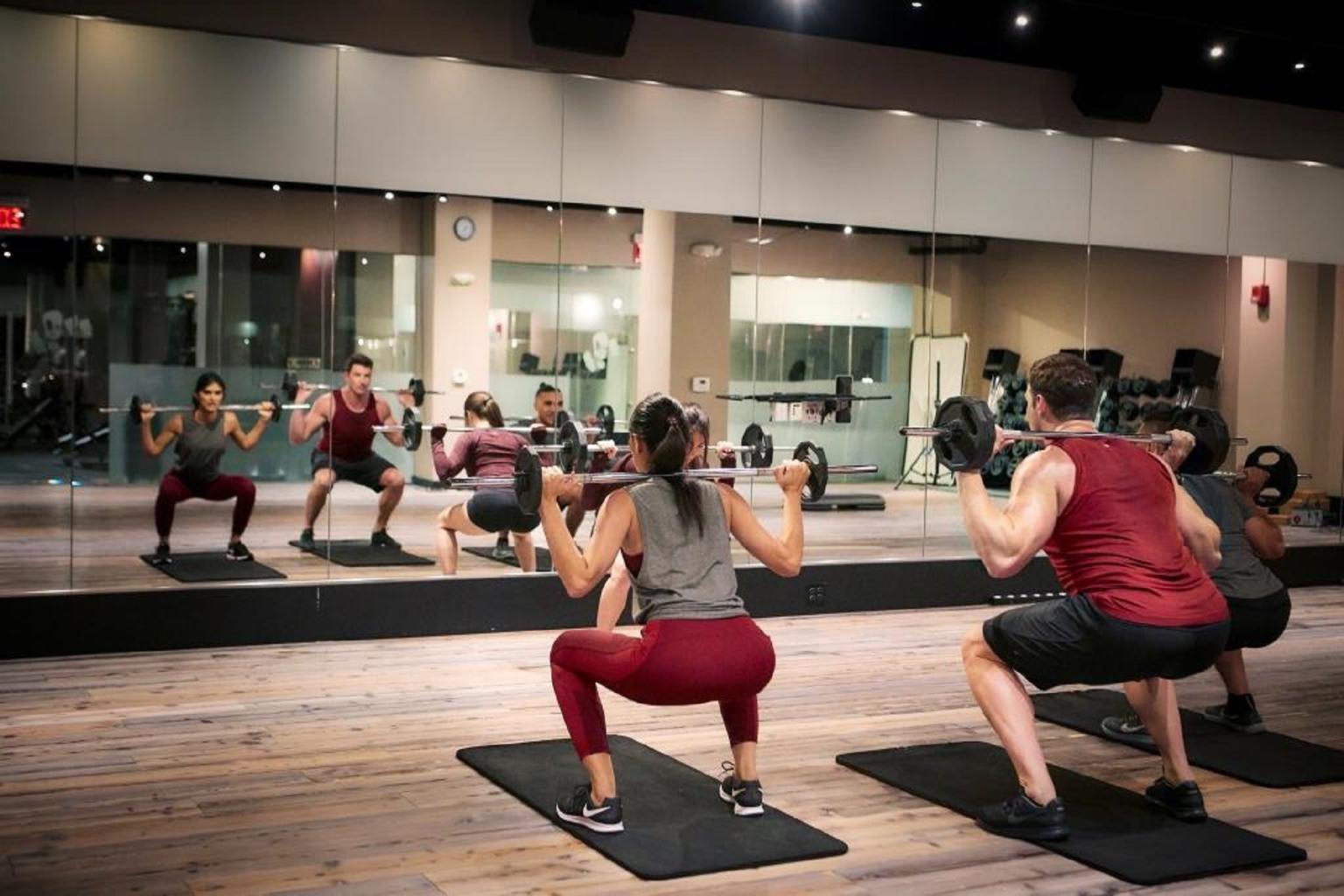 Two people participating in a Lynx workout class
