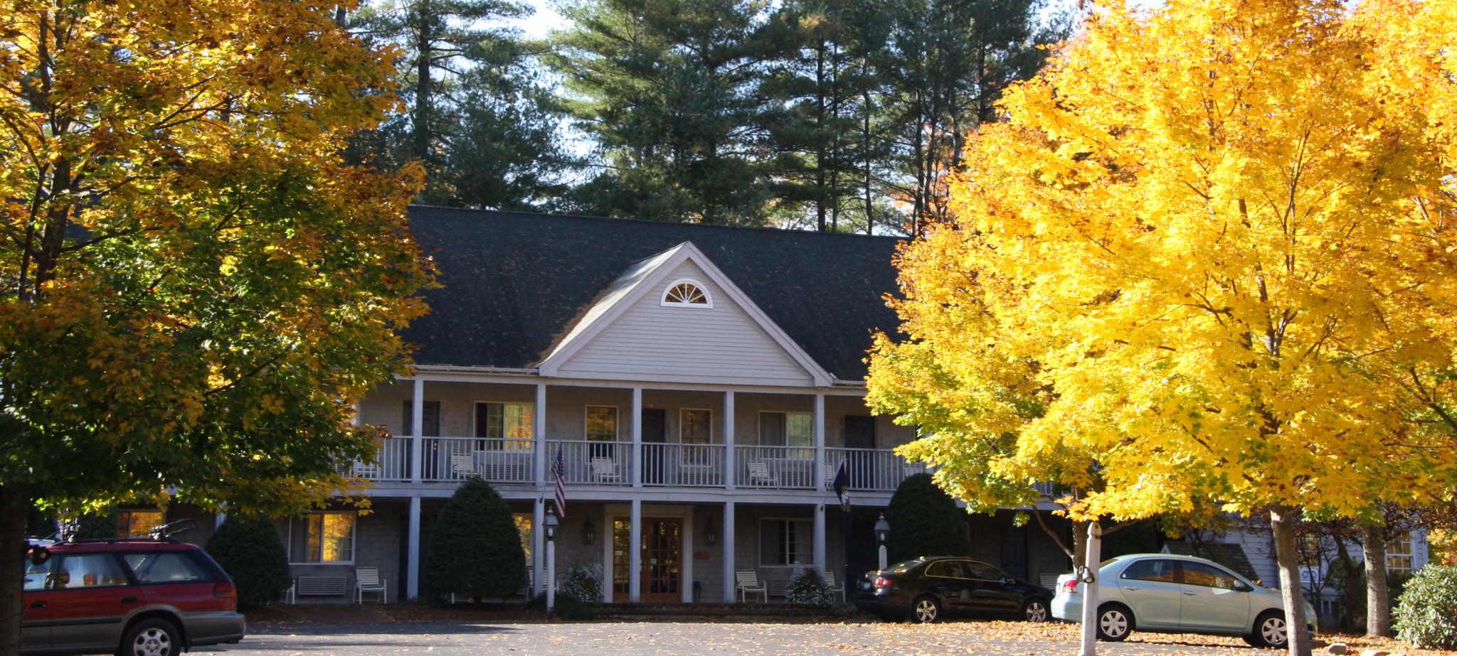 hotel exterior framed by gorgeous fall foliage.